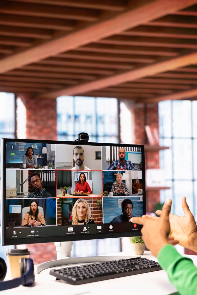 Manager talking with employees during videocall from home